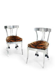 A PAIR OF POLISHED STEEL KLISMOS SIDE CHAIRS