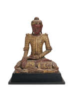 Asie du Sud-Est. A SOUTH-EAST ASIAN RED-PAINTED AND PARCEL-GILT SEATED FIGURE OF BUDDHA