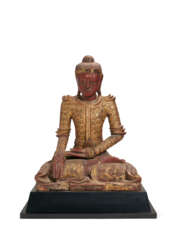 A SOUTH-EAST ASIAN RED-PAINTED AND PARCEL-GILT SEATED FIGURE OF BUDDHA