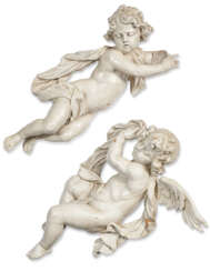 A PAIR OF GERMAN CREAM-PAINTED WOOD PUTTI