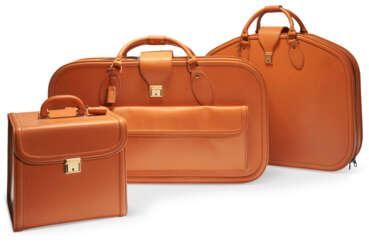 A SET OF THREE FITTED TAN LEATHER LUGGAGE FOR A FERRARI 456 GT