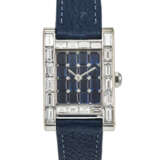 CARTIER. A POSSIBLY UNIQUE AND OPULENT 18K WHITE GOLD AND BAGUETTE DIAMOND-SET RECTANGULAR WRISTWATCH WITH BAGUETTE SAPPHIRE DIAL AND DIAMOND-SET CLASP - фото 1