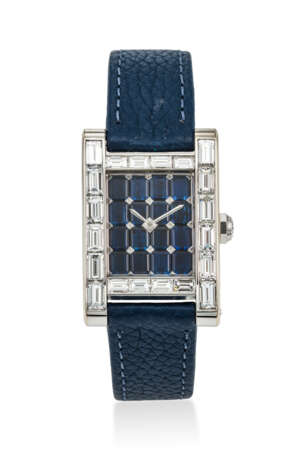 CARTIER. A POSSIBLY UNIQUE AND OPULENT 18K WHITE GOLD AND BAGUETTE DIAMOND-SET RECTANGULAR WRISTWATCH WITH BAGUETTE SAPPHIRE DIAL AND DIAMOND-SET CLASP - фото 1