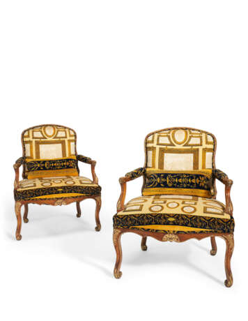 A PAIR OF FRENCH PARCEL-GILT AND STAINED BEECH FAUTEUILS - фото 1