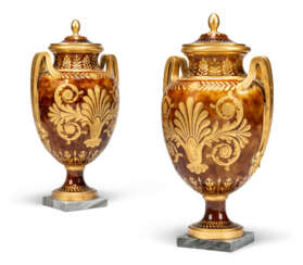 A PAIR OF SEVRES PORCELAIN TORTOISESHELL-GROUND TWO-HANDLED VASES AND COVERS