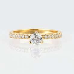 A petite Solitaire Diamond Ring.