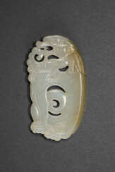 A WHITE JADE ARCHAISTIC &#39;MYTHICAL BEAST&#39; PLAQUE