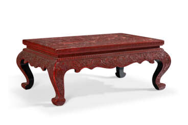 A CARVED RED LACQUER KANG TABLE