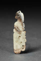 A PALE GREYISH-BEIGE AND BROWN JADE PENDANT