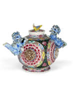 Teapot. A FAMILLE ROSE MOLDED AND RETICULATED TEAPOT AND COVER