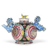 A FAMILLE ROSE MOLDED AND RETICULATED TEAPOT AND COVER - photo 2