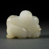 A WHITE JADE CARVING OF A MAN WITH BUDDHIST LION - photo 4