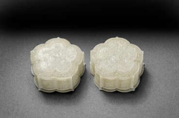 AN UNUSUAL PAIR OF PALE GREYISH-WHITE JADEITE RETICULATED FLOWER-SHAPED BOXES AND COVERS