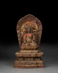 A RARE GILT-LACQUERED WOOD FIGURE OF MEDICINE BUDDHA ENTHRONED