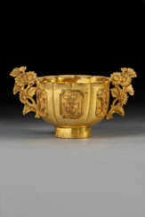 A SMALL GILT-BRONZE &#39;BIRD AND FLOWER&#39; TWO-HANDLED CUP