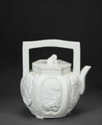 Teapots and coffee pots. A MOLDED DEHUA HEXAGONAL TEAPOT AND COVER
