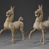 A PAIR OF LARGE PAINTED POTTERY FIGURES OF PRANCING HORSES - photo 1