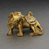 A SMALL GILT-BRONZE FIGURE OF MYTHICAL BEAST - фото 1