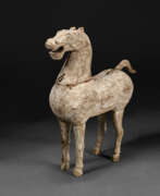 Han dynasty. A RARE SMALL WOOD FIGURE OF A STANDING HORSE