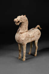 A RARE SMALL WOOD FIGURE OF A STANDING HORSE