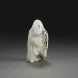 A RARE WHITE AND BLACK JADE FIGURE OF A FOREIGN TRIBUTE BEARER - photo 1