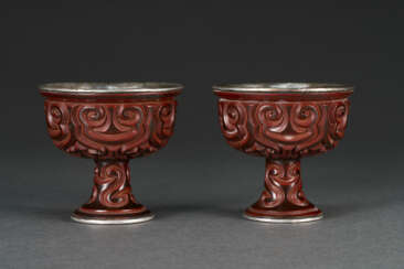 A PAIR OF TIXI LACQUER STEM CUPS