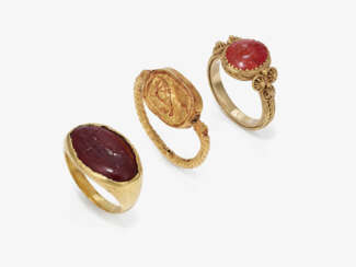 A ring with cylinder seal and two gem rings. 2nd-3rd century AD setting of the ring with the small carnelian gem: 19th century