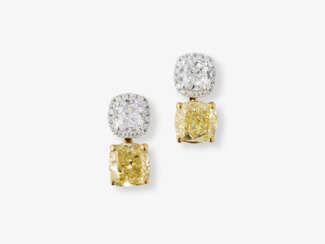 Convertible, highlighted stud earrings decorated with a natural white and yellow diamond. Belgium, ANTWERP ATELIERS