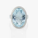 An entourage ring decorated with a fine, bright, large aquamarine and brilliant-cut diamonds. Germany - photo 2