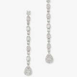 A pair of delicate, long drop earrings decorated with diamonds in different cuts. Germany - photo 1