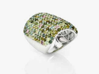 A magnificent cocktail ring decorated with tourmalines in fine multi-coloured nuances. Germany