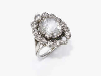 An entourage ring with diamonds. The large diamond was cut in the 18th century