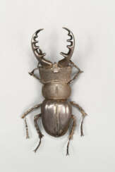 A SMALL SILVER ARTICULATED SCULPTURE OF A STAG BEETLE