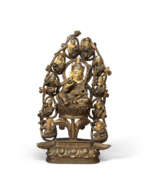 Tibet. A BRONZE FIGURE OF PADMASAMBHAVA WITH MANIFESTATIONS AND DISCIPLES
