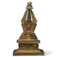 A GILT-BRONZE STUPA - Auktionspreise