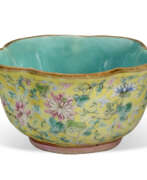 Cups. A SMALL YELLOW-GROUND FAMILLE ROSE FOLIATE CUP