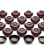 Meiji period. A SET OF TWENTY LACQUER BOWLS AND COVERS