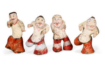 A GROUP OF FIVE PAINTED POTTERY FIGURES OF ENTERTAINERS