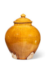 AN AMBER-GLAZED OVOID JAR AND COVER