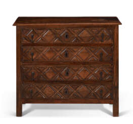 A SPANISH OAK AND WALNUT CHEST-OF-DRAWERS