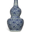 A CHINESE BLUE AND WHITE DOUBLE GOURD VASE - Auction archive
