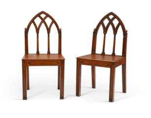 A PAIR OF VICTORIAN OAK 'GOTHICK' HALL CHAIRS