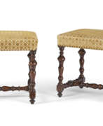 Chairs. A PAIR OF NORTH EUROPEAN WALNUT STOOLS