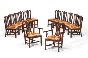 A SET OF TWELVE ENGLISH CARVED MAHOGANY DINING CHAIRS