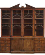 Thomas Chippendale. AN EARLY GEORGE III MAHOGANY BREAKFRONT-BOOKCASE