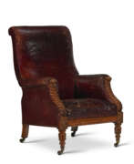Leather. A VICTORIAN LEATHER-UPHOLSTERED OAK LIBRARY ARMCHAIR