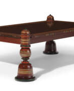 Wood. AN INDIAN STYLE RED AND POLYCHROME PAINTED COFFEE TABLE