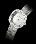 Women's wrist watch. BUCHERER, WHITE GOLD AND DIAMOND-SET BRACELET WATCH