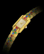 Women's wrist watch. CARTIER, GOLD, DIAMOND AND MULTI-GEM BRACELET WATCH
