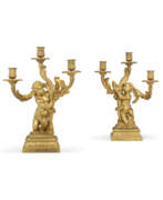Gold. A PAIR OF FRENCH ORMOLU TWO-BRANCH CANDELABRA